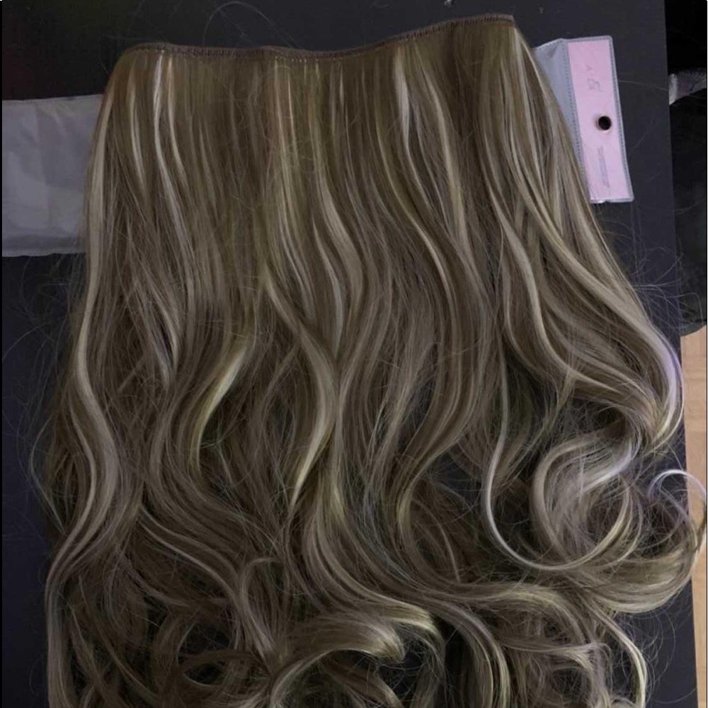 One piece hair extension. Blonde with streaks